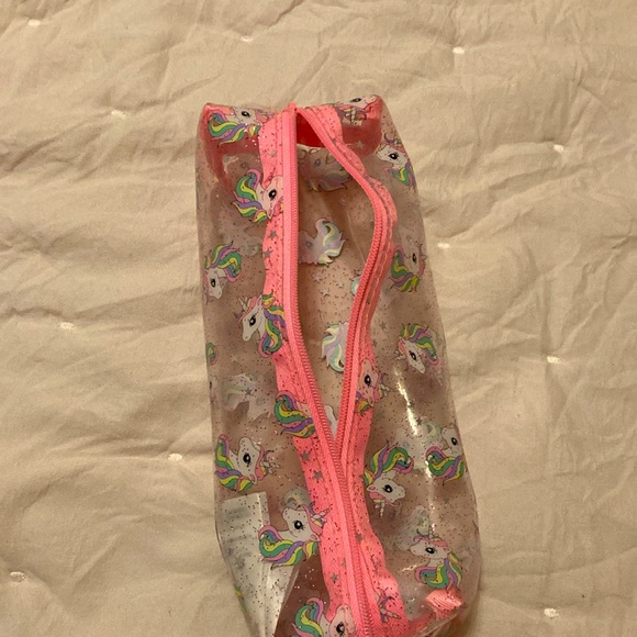 A pink, white, clear unicorn pouch. From: H&M. Name: Unicorn Pouch - Picture 5 of 5